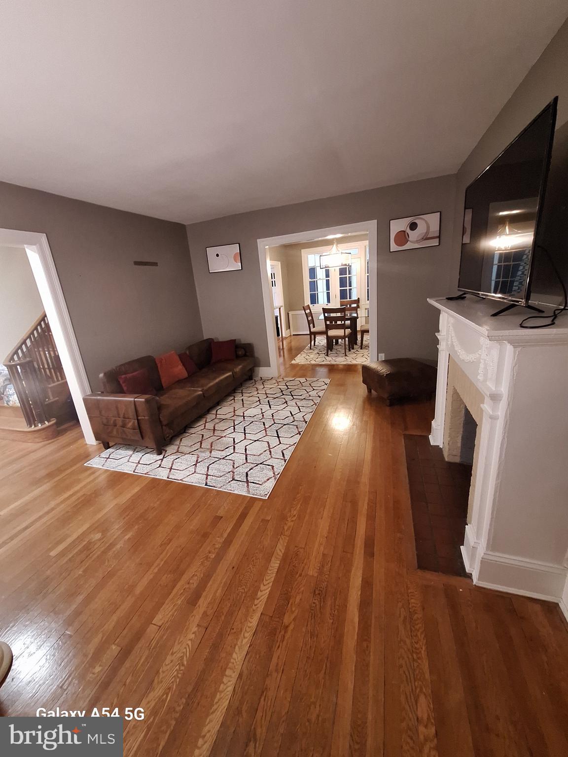 3815 W Street Northwest Washington, DC 20007 - Photo 8 of 13 a living room with furniture and a fireplace
