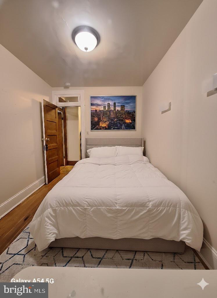 3815 W Street Northwest Washington, DC 20007 - Photo 9 of 13 a large bed sitting in a bedroom next to a window