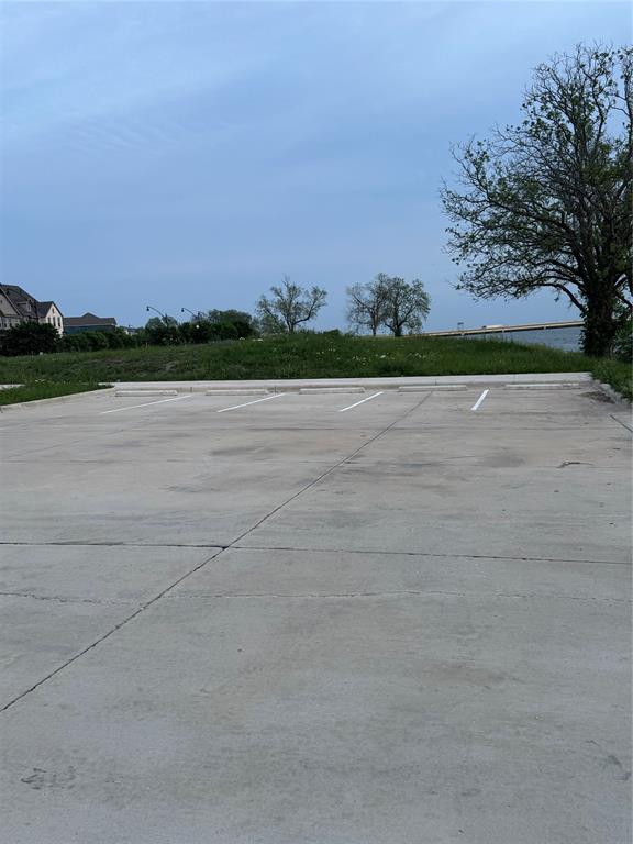 7849 Sunset Boulevard Rowlett, TX 75088 - Photo 19 of 19 Expansive paved parking area featuring white line markings