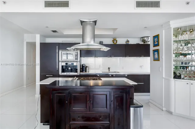 a kitchen with a stove and a refrigerator