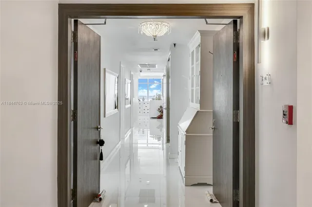 view of a bathroom with a glass shower door and a mirror