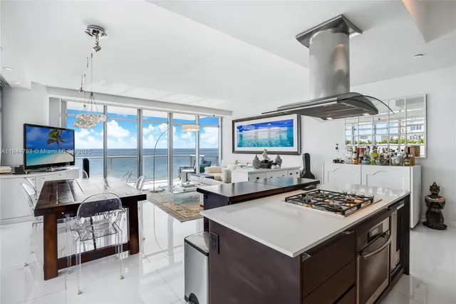 a kitchen with a stove a sink and a table