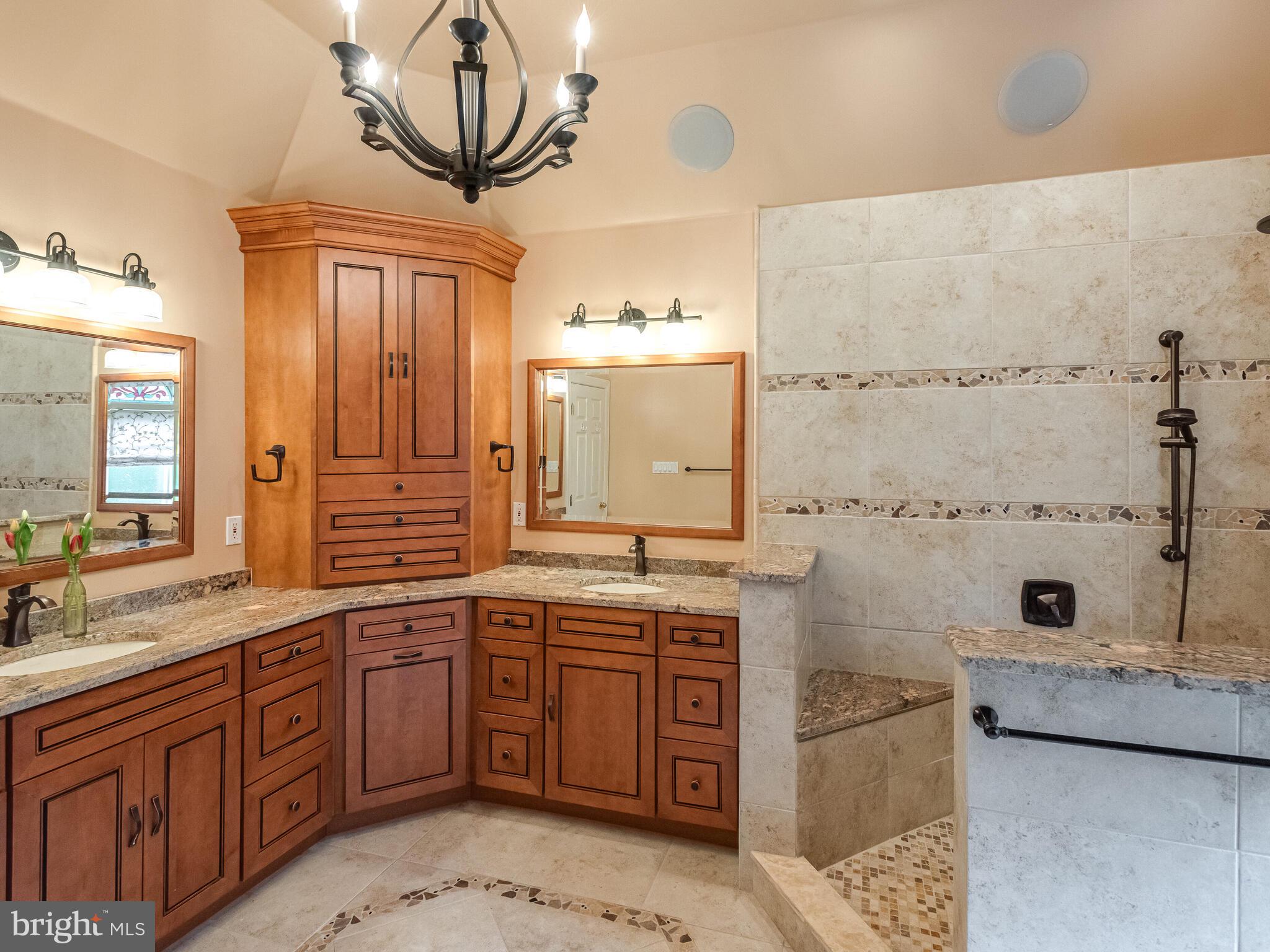 648 East Reeceville Road Coatesville, PA 19320 - Photo 26 of 49 a bathroom with a granite countertop sink a mirror and a bathtub