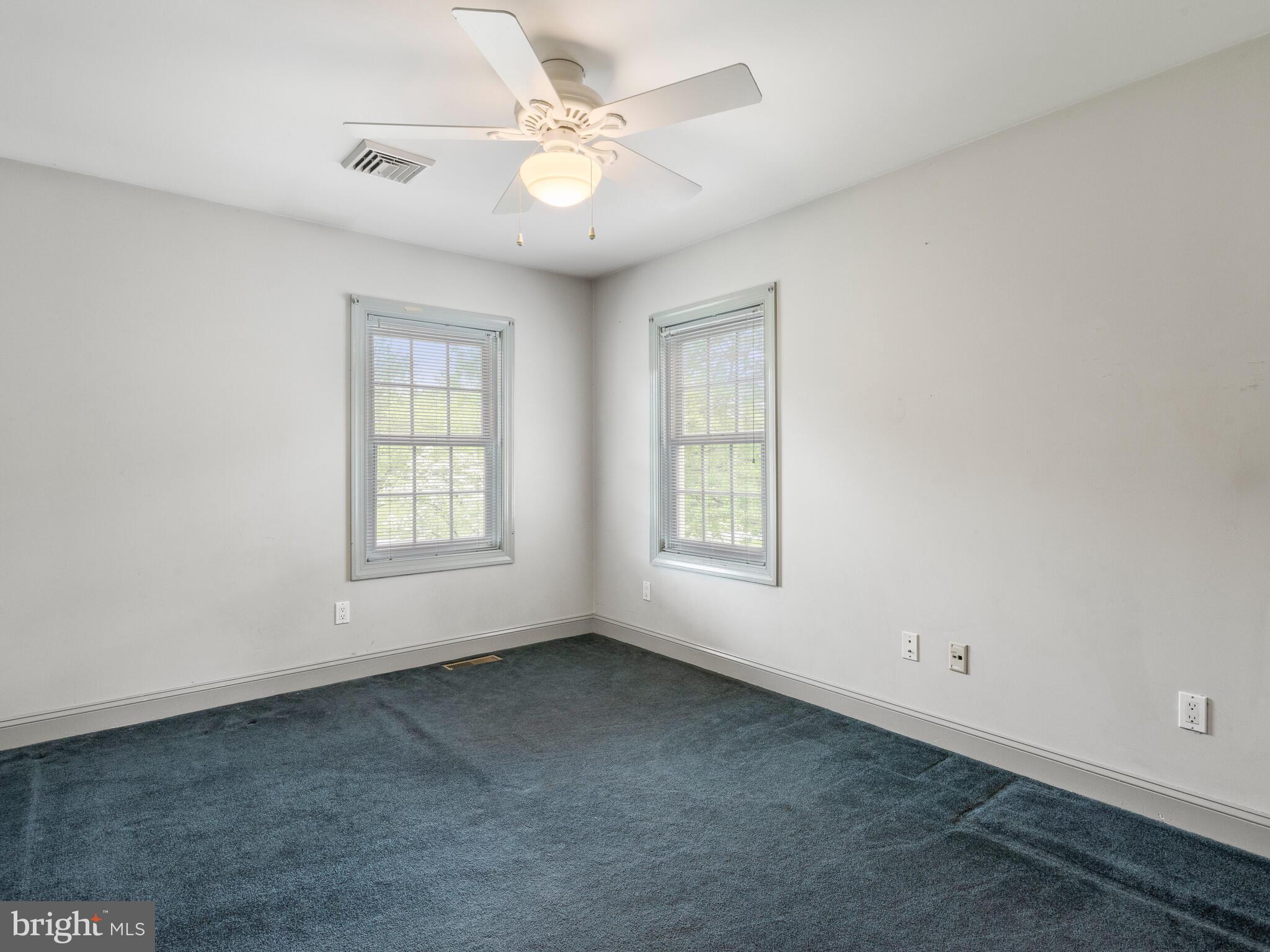 648 East Reeceville Road Coatesville, PA 19320 - Photo 29 of 49 an empty room with windows and fan