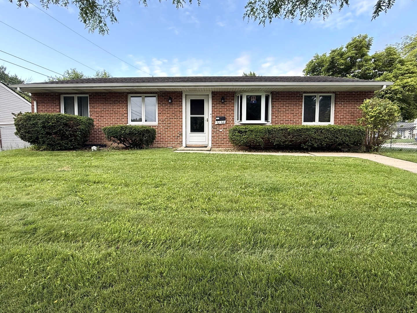 5199 Elmwood Road Oak Forest, IL 60452 - Photo 1 of 30 a front view of a house with a garden