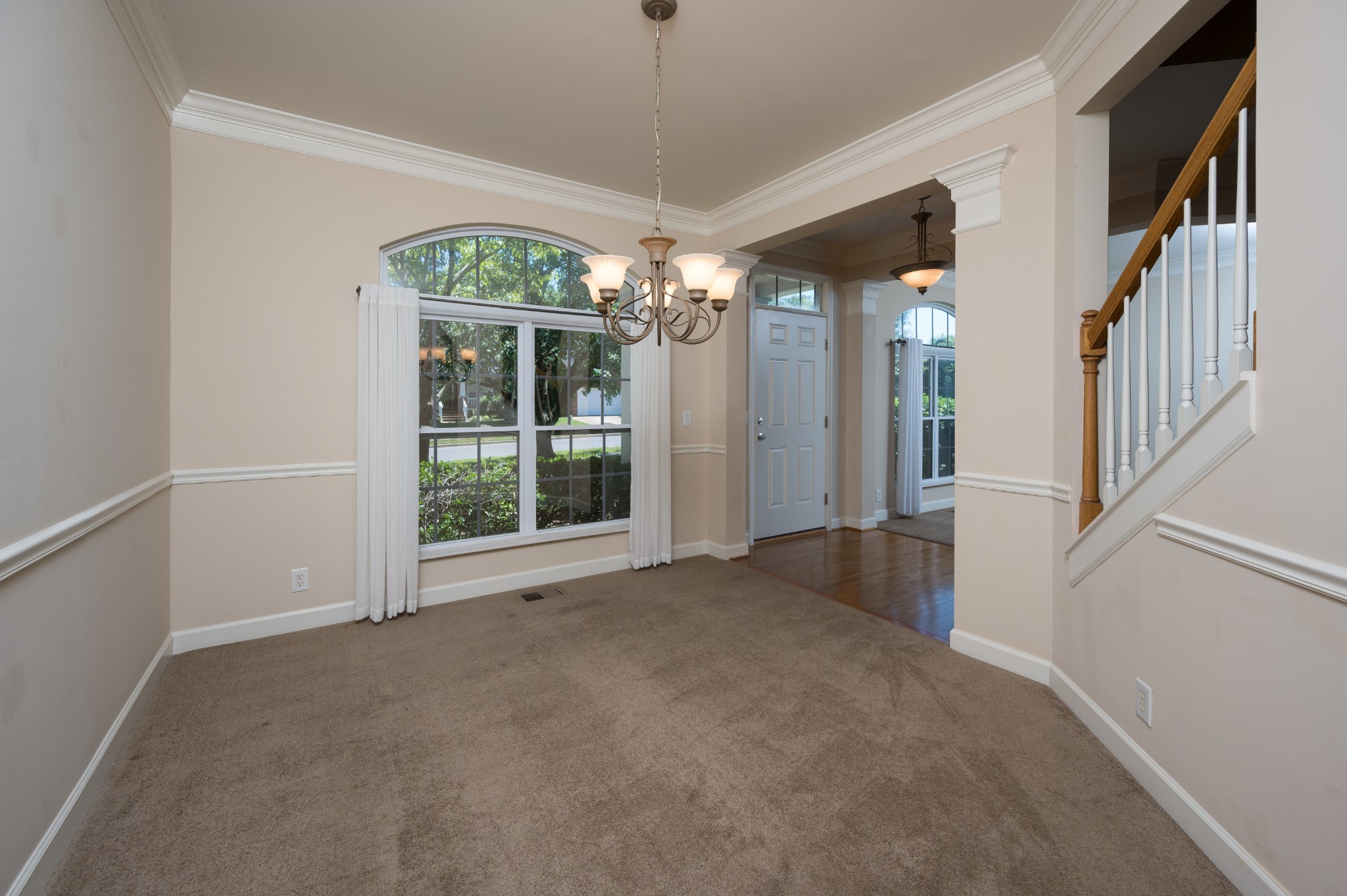 1322 Tilton Drive Franklin, TN 37067 - Photo 11 of 60 a view of a big room with windows and chandelier
