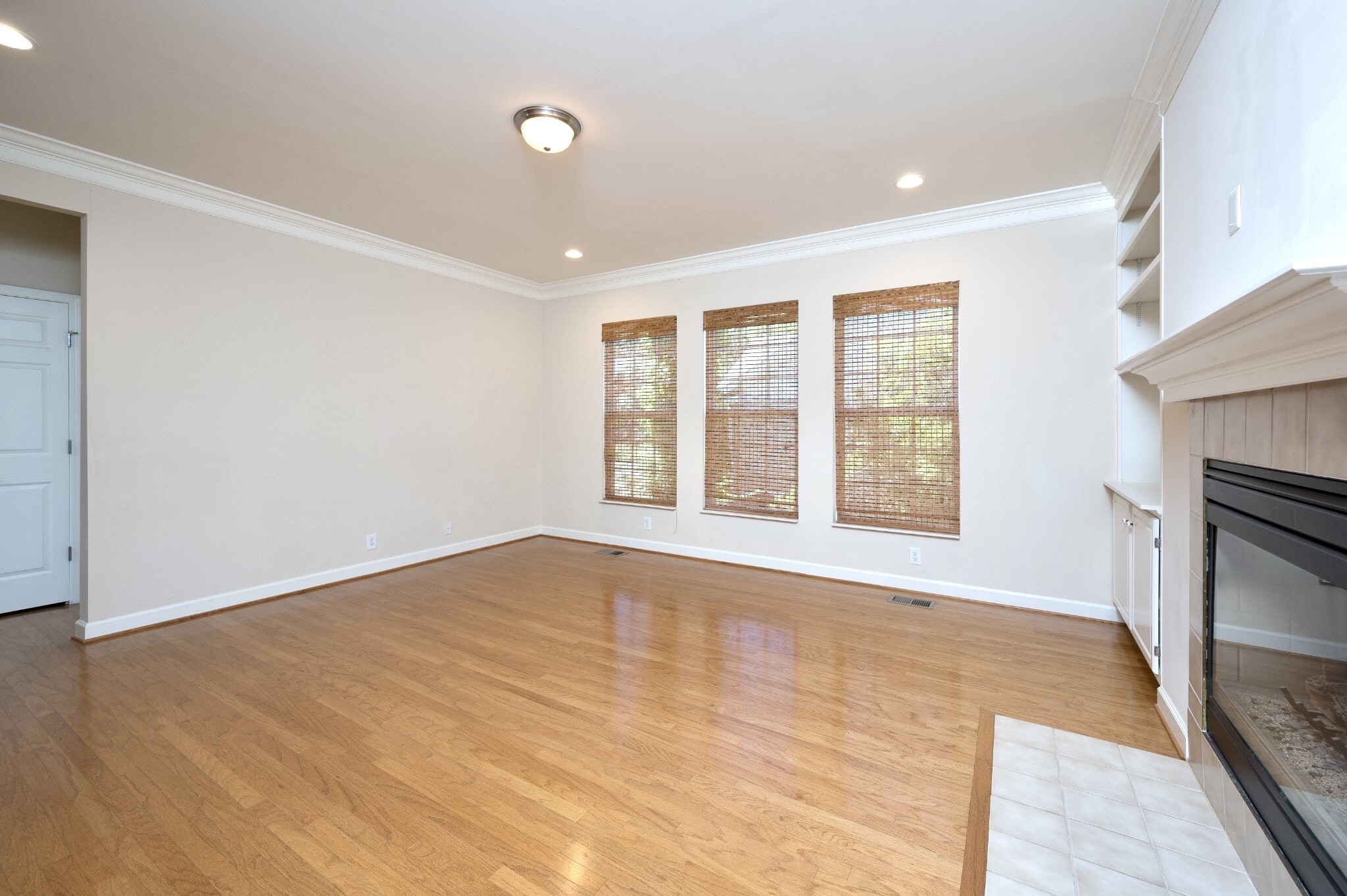 1322 Tilton Drive Franklin, TN 37067 - Photo 14 of 60 a view of an empty room with a window and a kitchen