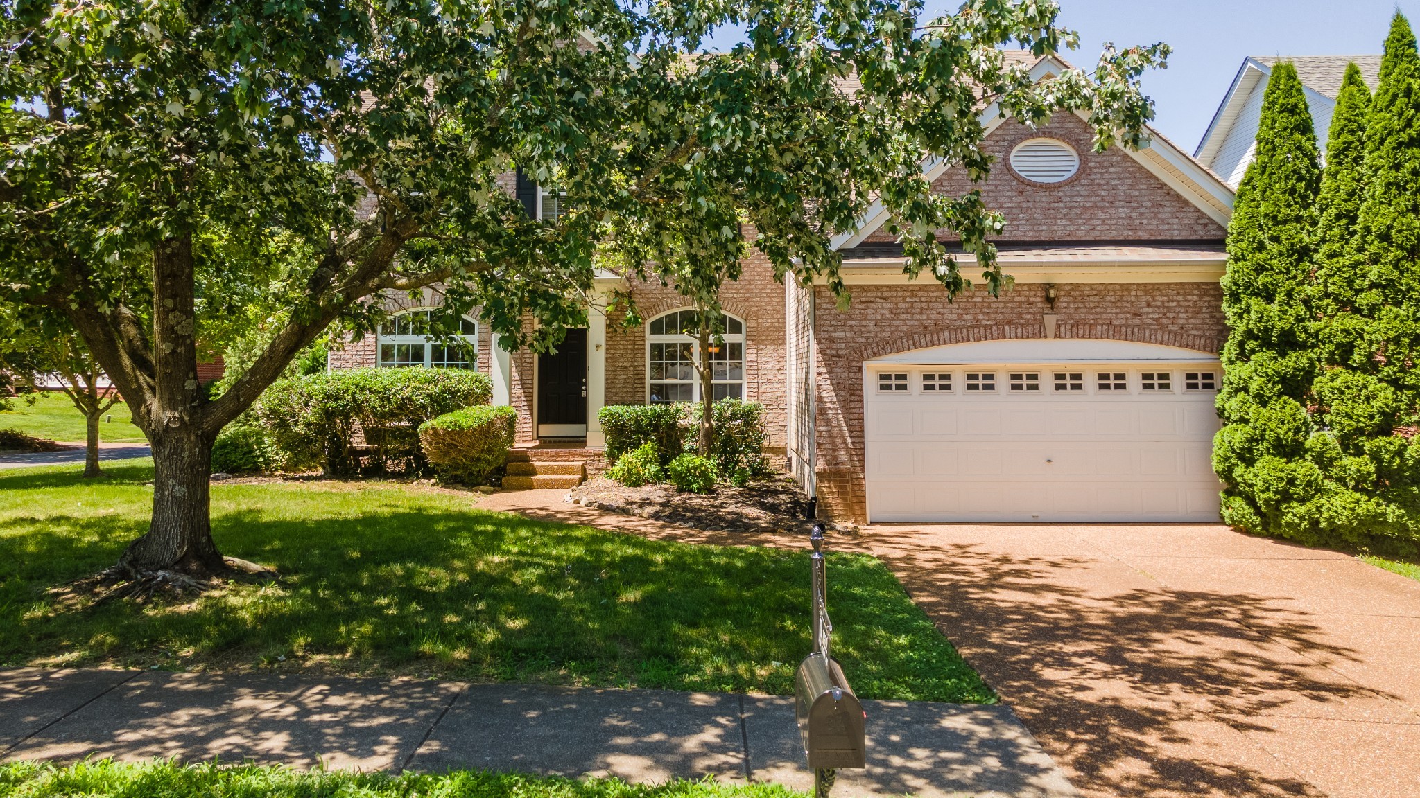 1322 Tilton Drive Franklin, TN 37067 - Photo 2 of 60 a front view of a house with garden