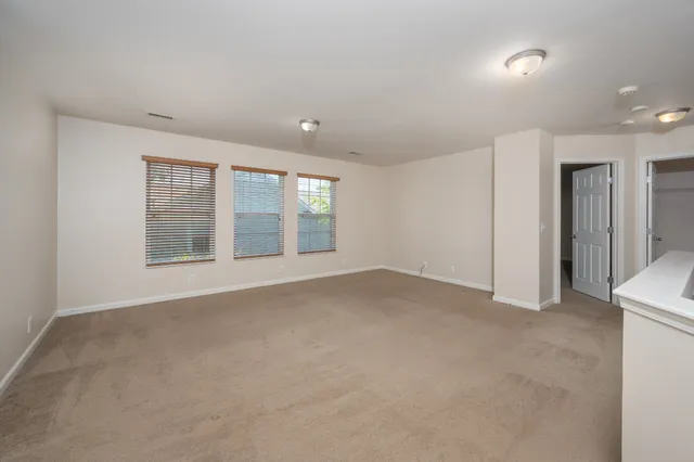 a view of a big room with carpet