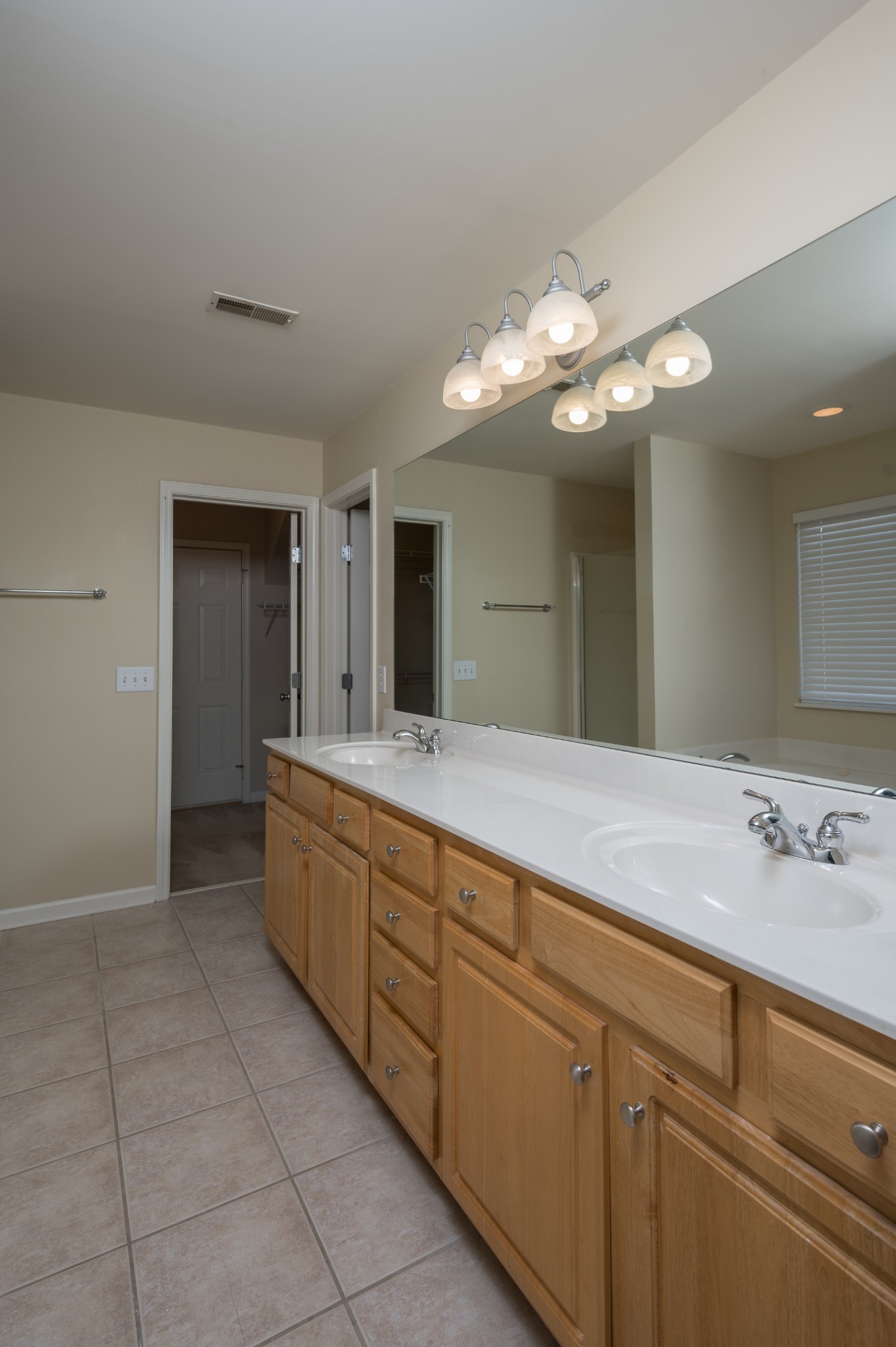 1322 Tilton Drive Franklin, TN 37067 - Photo 30 of 60 a spacious bathroom with a granite countertop sink a toilet and a mirror