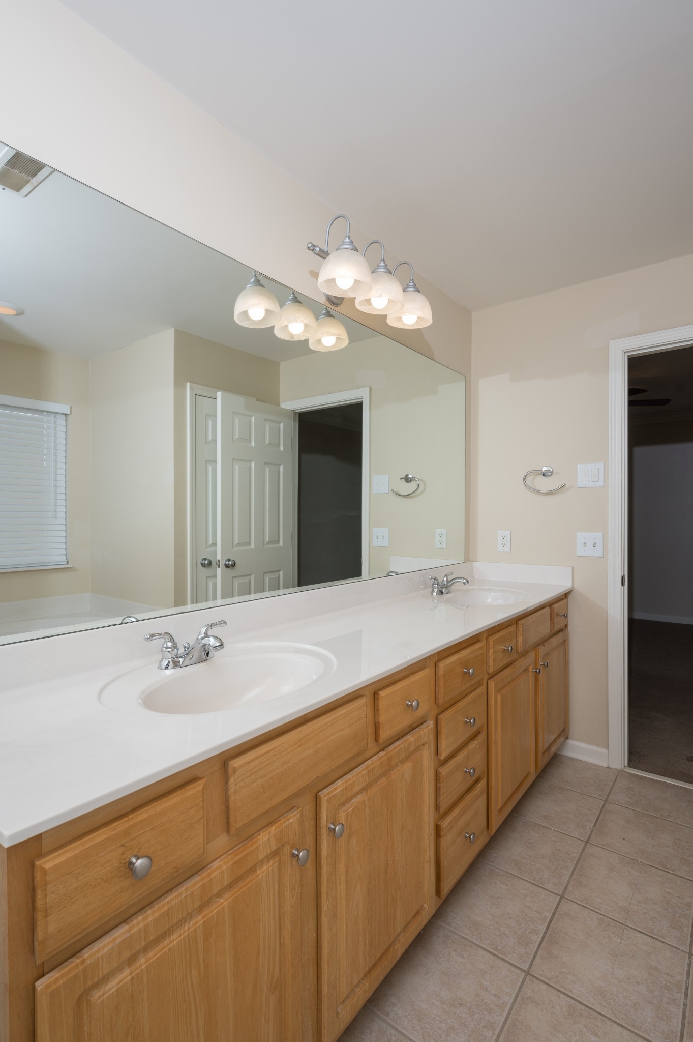 1322 Tilton Drive Franklin, TN 37067 - Photo 31 of 60 a bathroom with a double vanity sink and a mirror