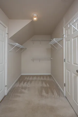 an empty room with closet area