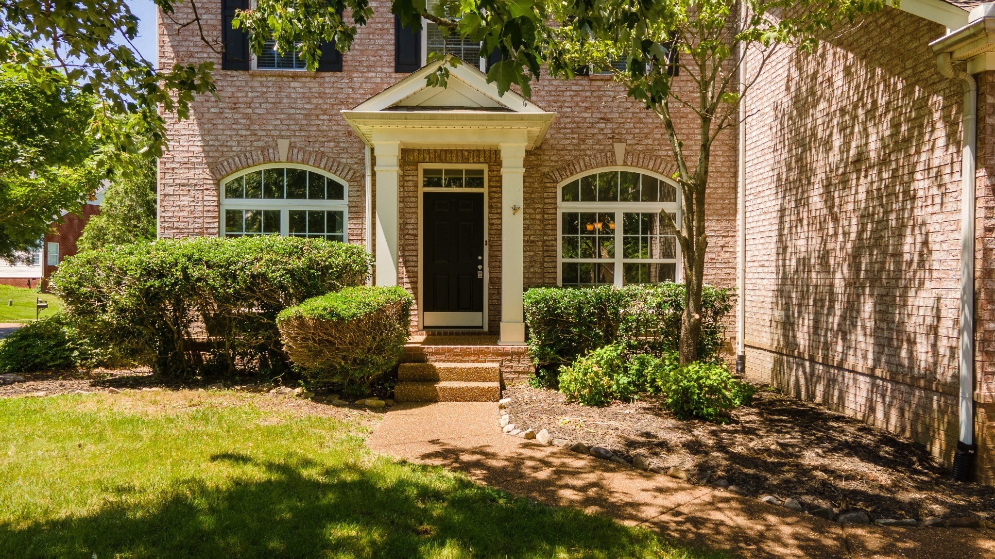 1322 Tilton Drive Franklin, TN 37067 - Photo 8 of 60 a front view of a house with a yard