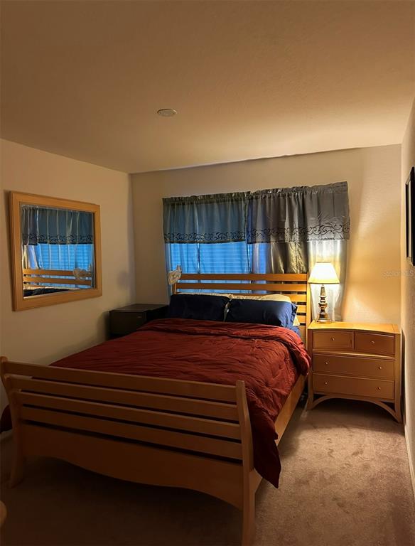 4600 East Moody Boulevard, Unit 3J Bunnell, FL 32110 - Photo 11 of 20 a bedroom with a bed and a window