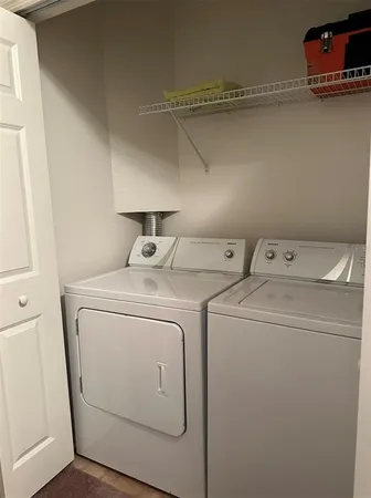 a bedroom with bed and window