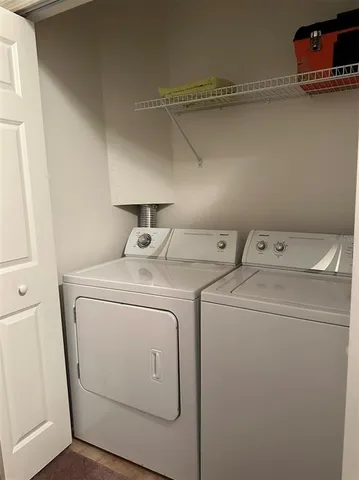 a bedroom with bed and window