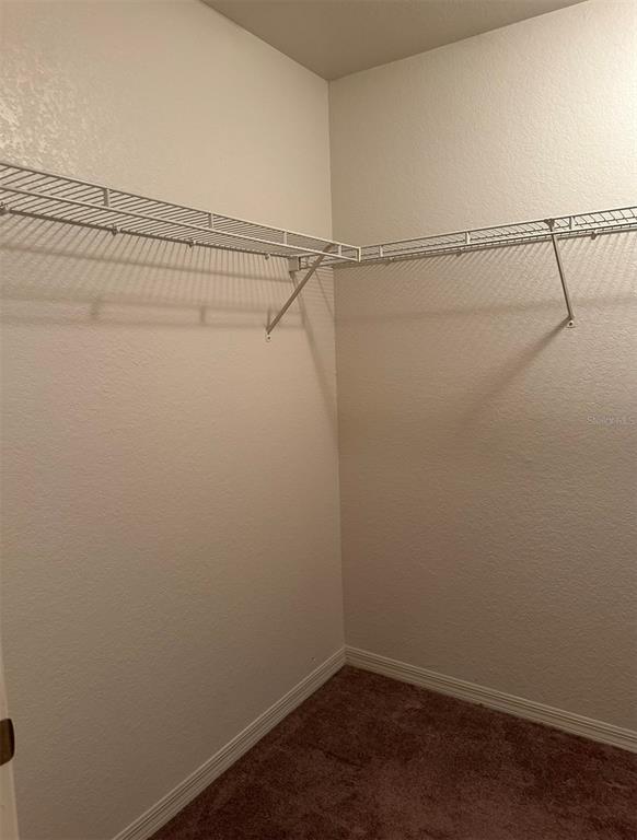 4600 East Moody Boulevard, Unit 3J Bunnell, FL 32110 - Photo 9 of 20 a view of a room with racks on the wall