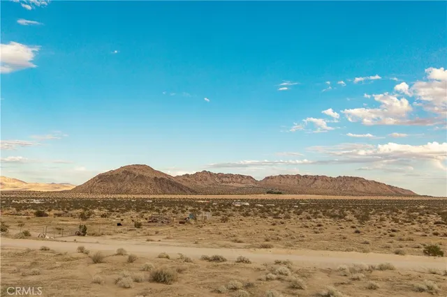 a view of an ocean and a mountain