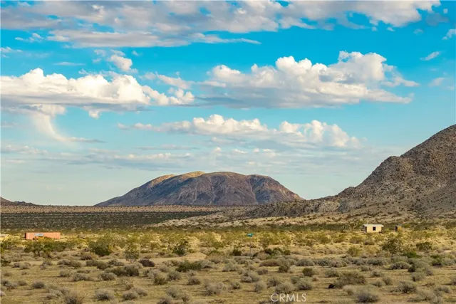 a view of ocean and mountain