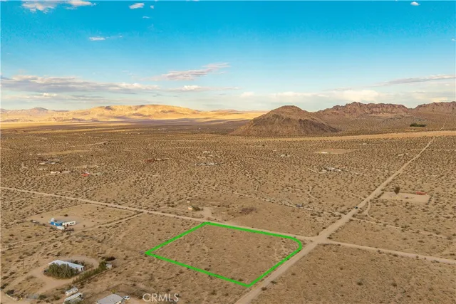 a view of an ocean beach and mountain