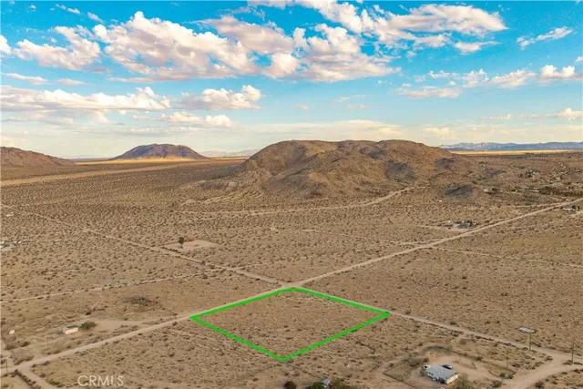 a view of an ocean with a mountain