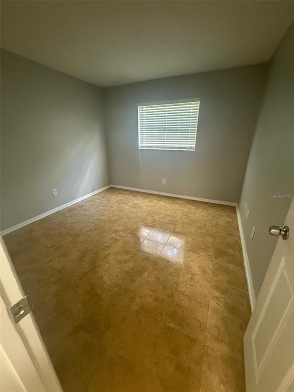 Undisclosed Address Clearwater, FL 33755 - Photo 11 of 13 a view of an empty room and window