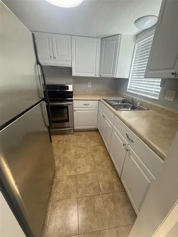 a kitchen with a cabinets and appliances