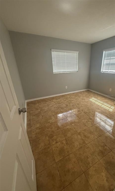 Undisclosed Address Clearwater, FL 33755 - Photo 9 of 13 a view of an empty room and window