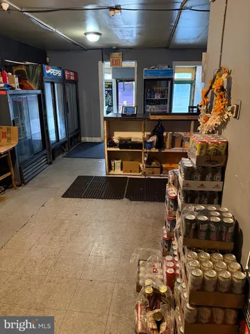 a kitchen with a sink a stove and a microwave