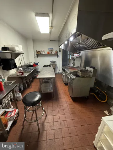 a living room with lots of furniture and air hockey table