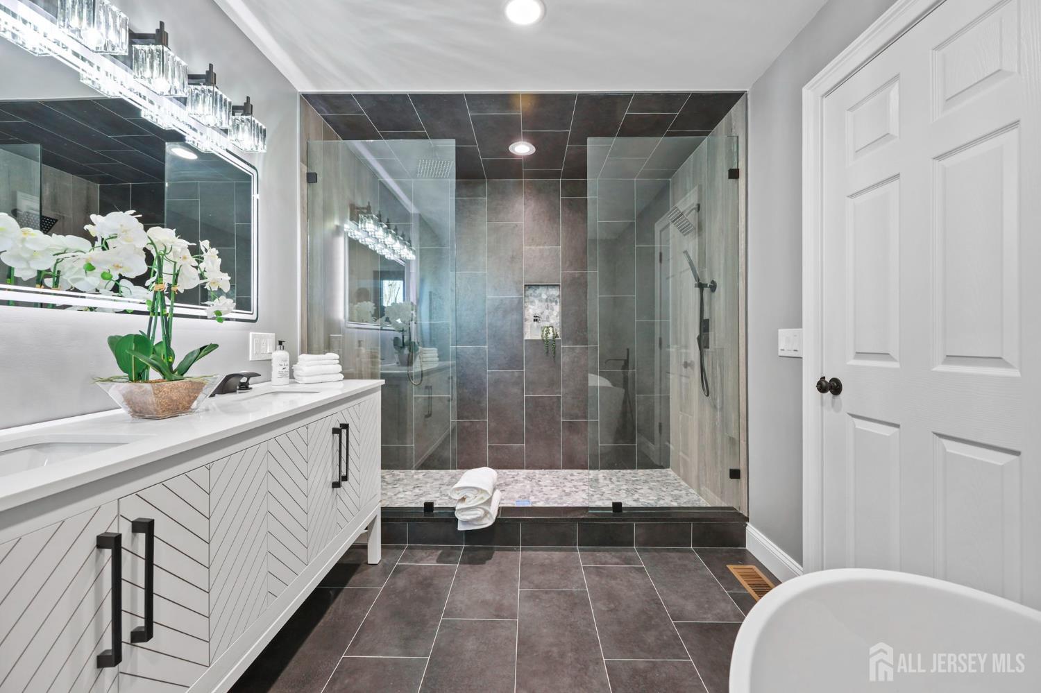 120 Nolan Road Morganville, NJ 07751 - Photo 24 of 85 a bathroom with a double vanity sink toilet and shower