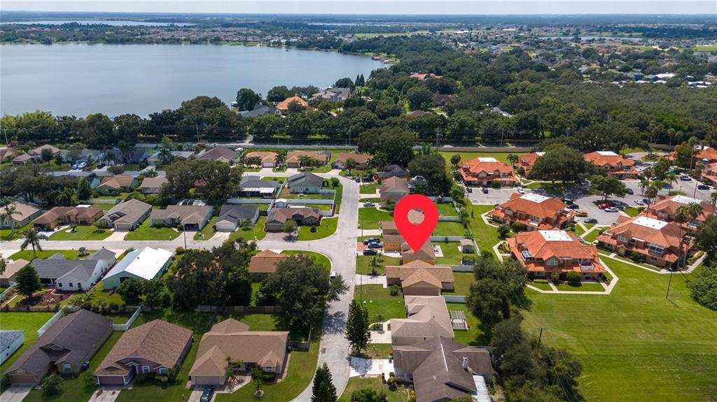 871 Reflections Loop East Winter Haven, FL 33884 - Photo 23 of 23 an aerial view of residential houses with outdoor space and lake view