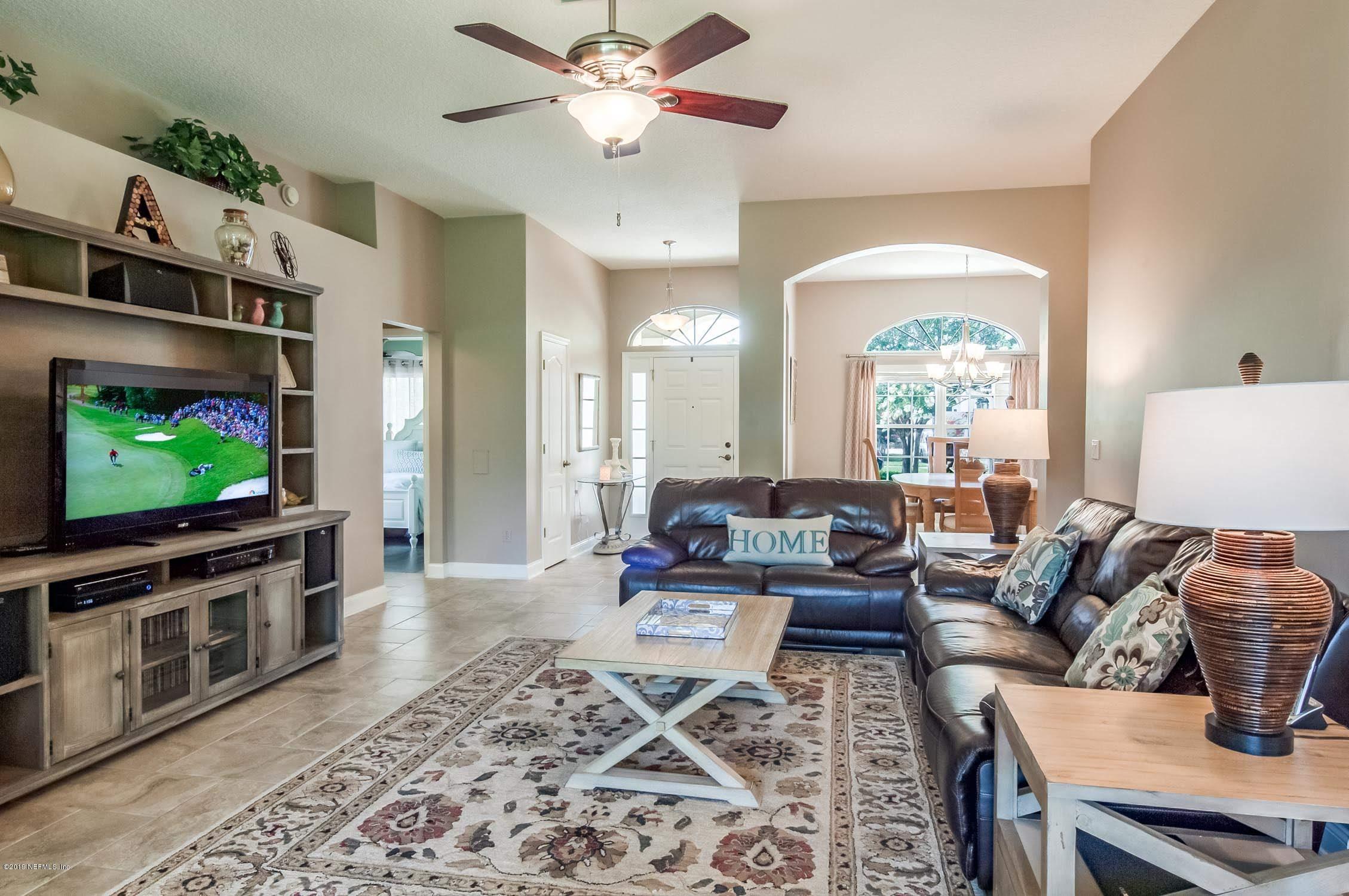 1152 Sandlake Road St. Augustine, FL 32092 - Photo 11 of 46 a living room with furniture and a flat screen tv
