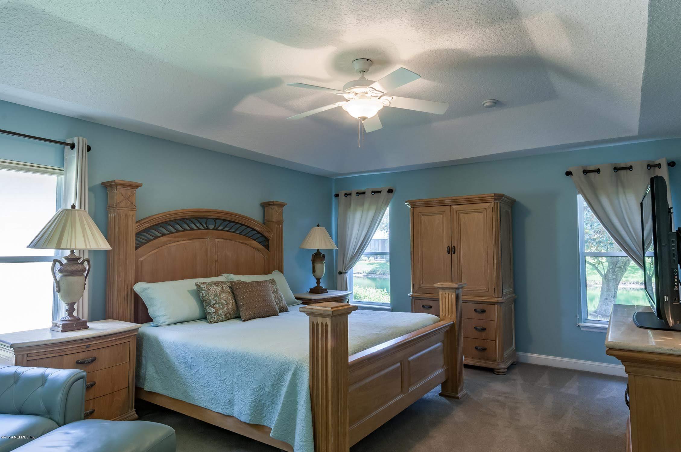 1152 Sandlake Road St. Augustine, FL 32092 - Photo 15 of 46 a bedroom with a bed and a dresser