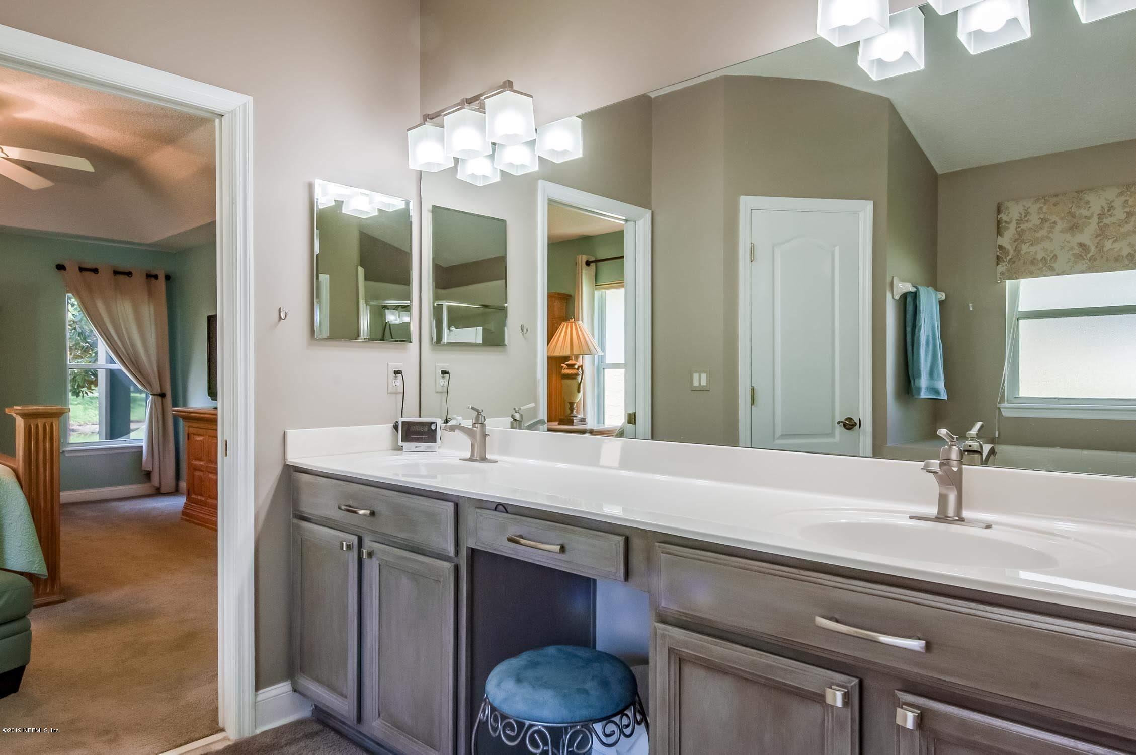1152 Sandlake Road St. Augustine, FL 32092 - Photo 17 of 46 a bathroom with a sink and a mirror