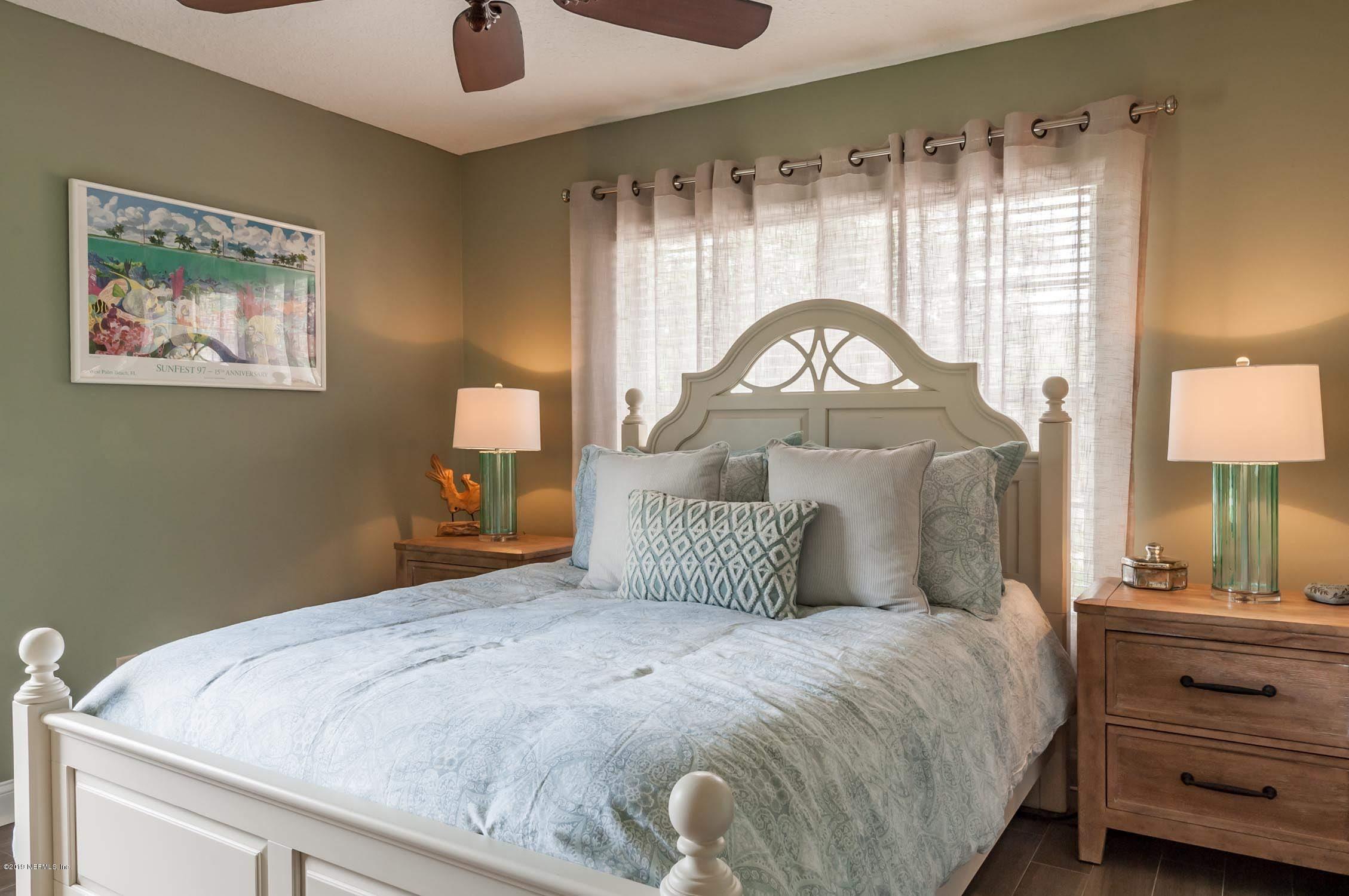 1152 Sandlake Road St. Augustine, FL 32092 - Photo 19 of 46 a bedroom with a bed and a painting on the wall