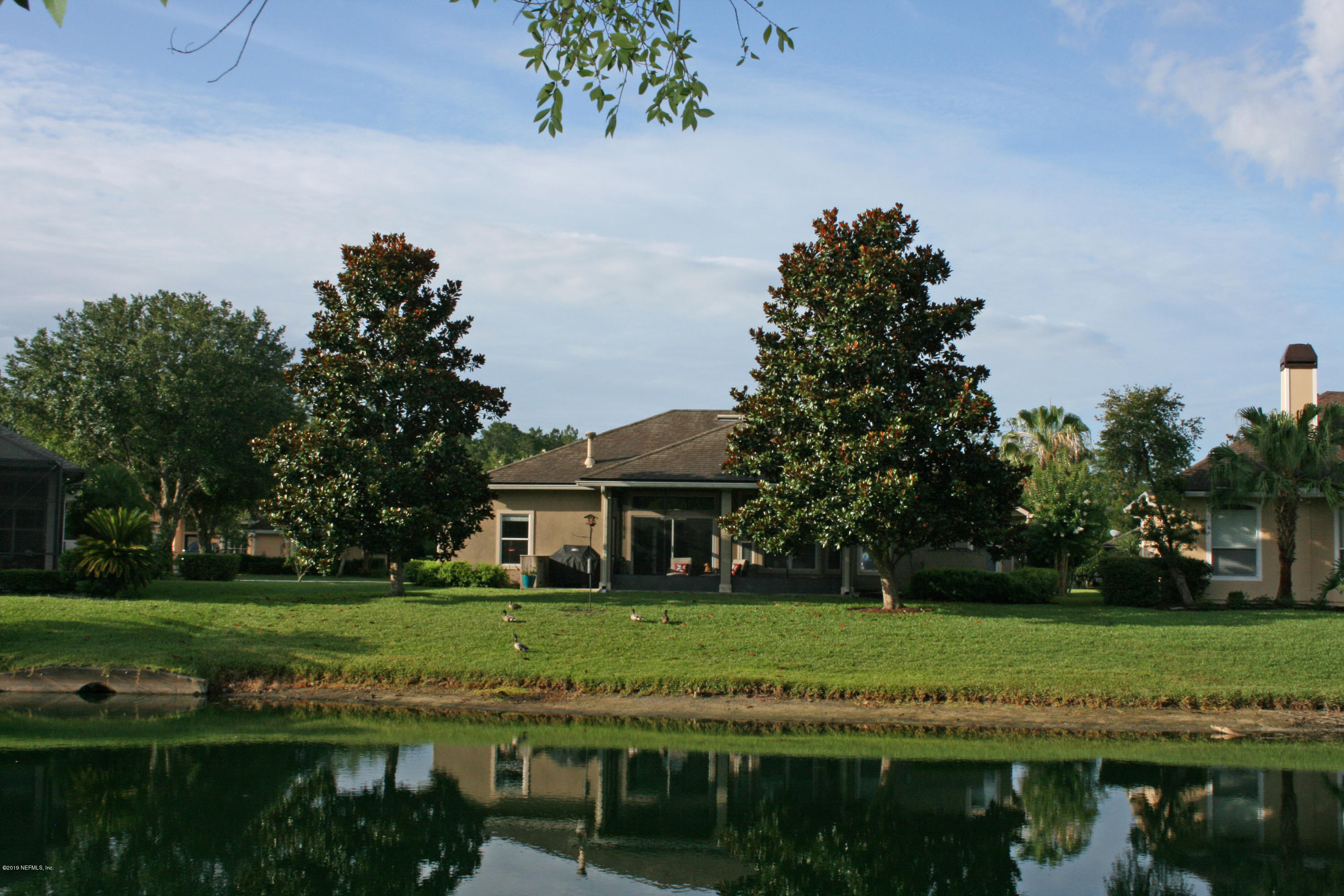 1152 Sandlake Road St. Augustine, FL 32092 - Photo 27 of 46 a front view of a house with a yard