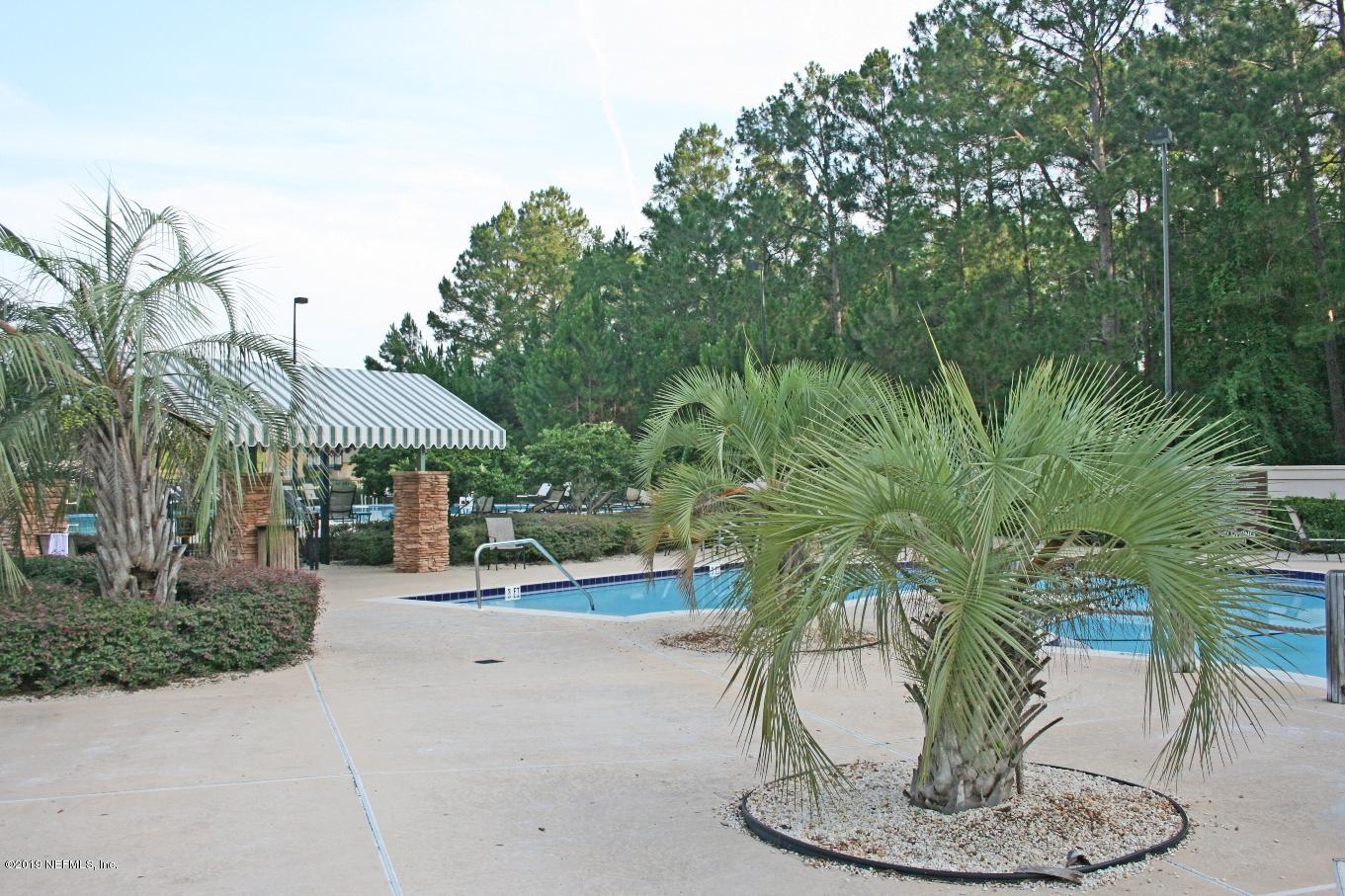 1152 Sandlake Road St. Augustine, FL 32092 - Photo 40 of 46 a view of a terrace with a table and chairs
