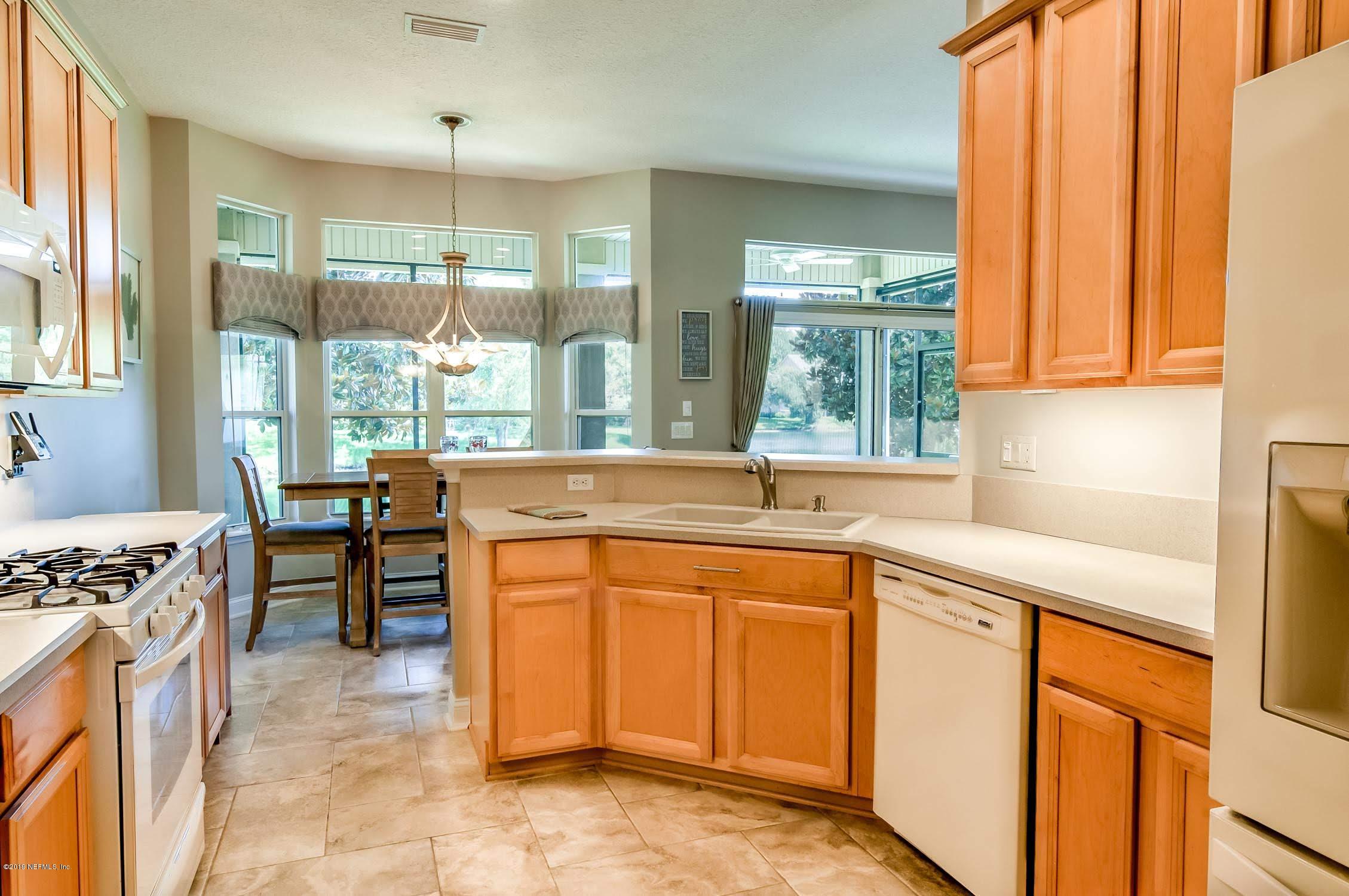1152 Sandlake Road St. Augustine, FL 32092 - Photo 4 of 46 a kitchen with stainless steel appliances granite countertop a sink and a stove