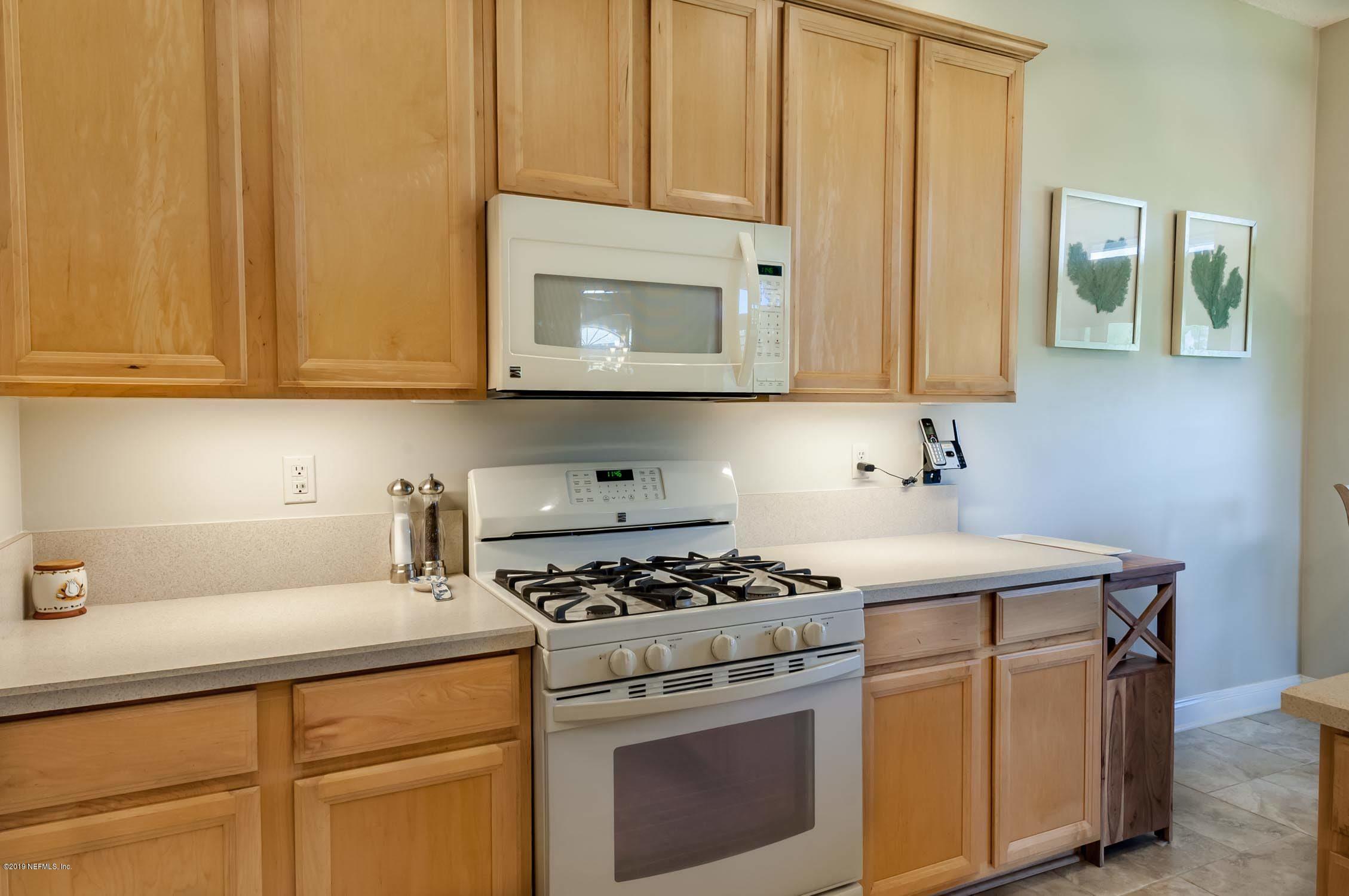 1152 Sandlake Road St. Augustine, FL 32092 - Photo 5 of 46 a kitchen with cabinets appliances and a sink