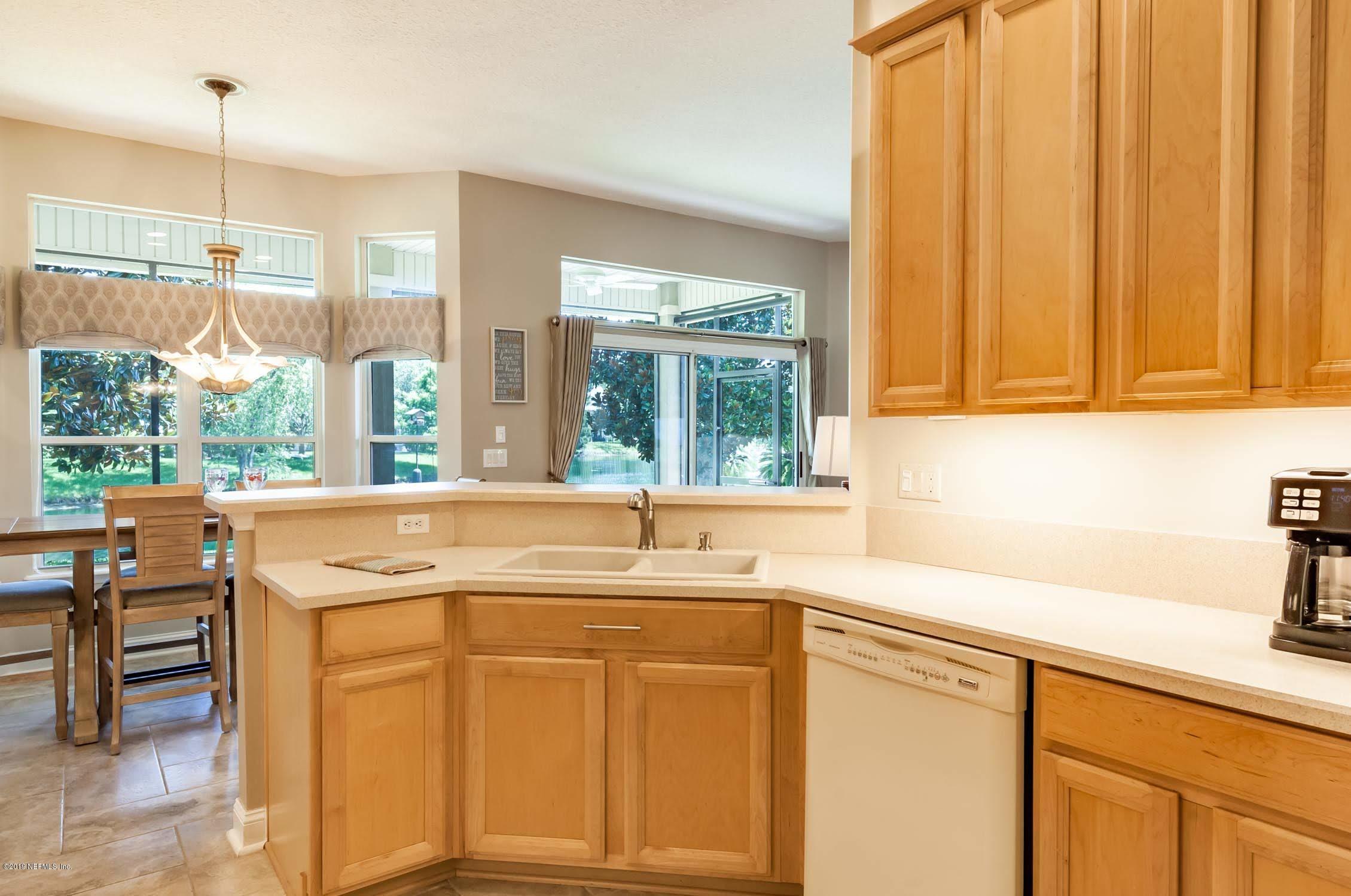 1152 Sandlake Road St. Augustine, FL 32092 - Photo 8 of 46 a kitchen with stainless steel appliances granite countertop a sink and a cabinets
