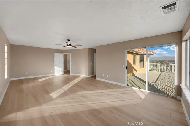 a view of a room with a large window