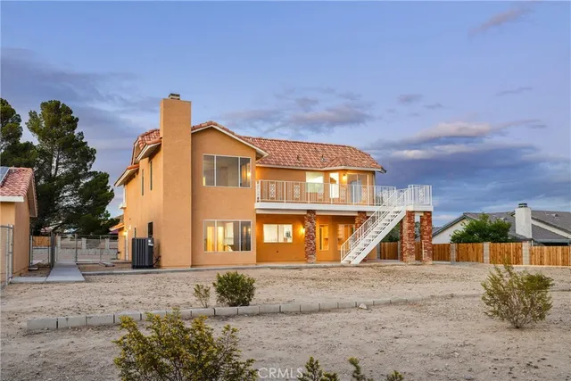 an aerial view of residential houses with city view