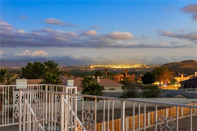 an aerial view of residential houses with city view