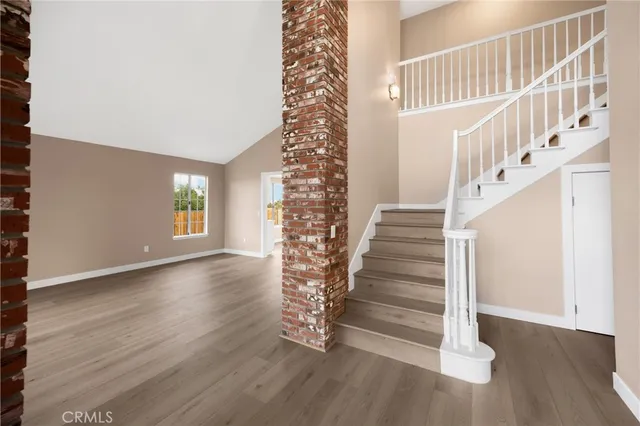 a view of entryway with wooden floor