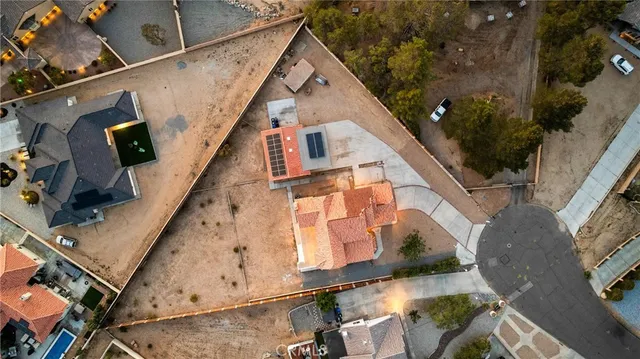 a view of a house with a yard and sitting area