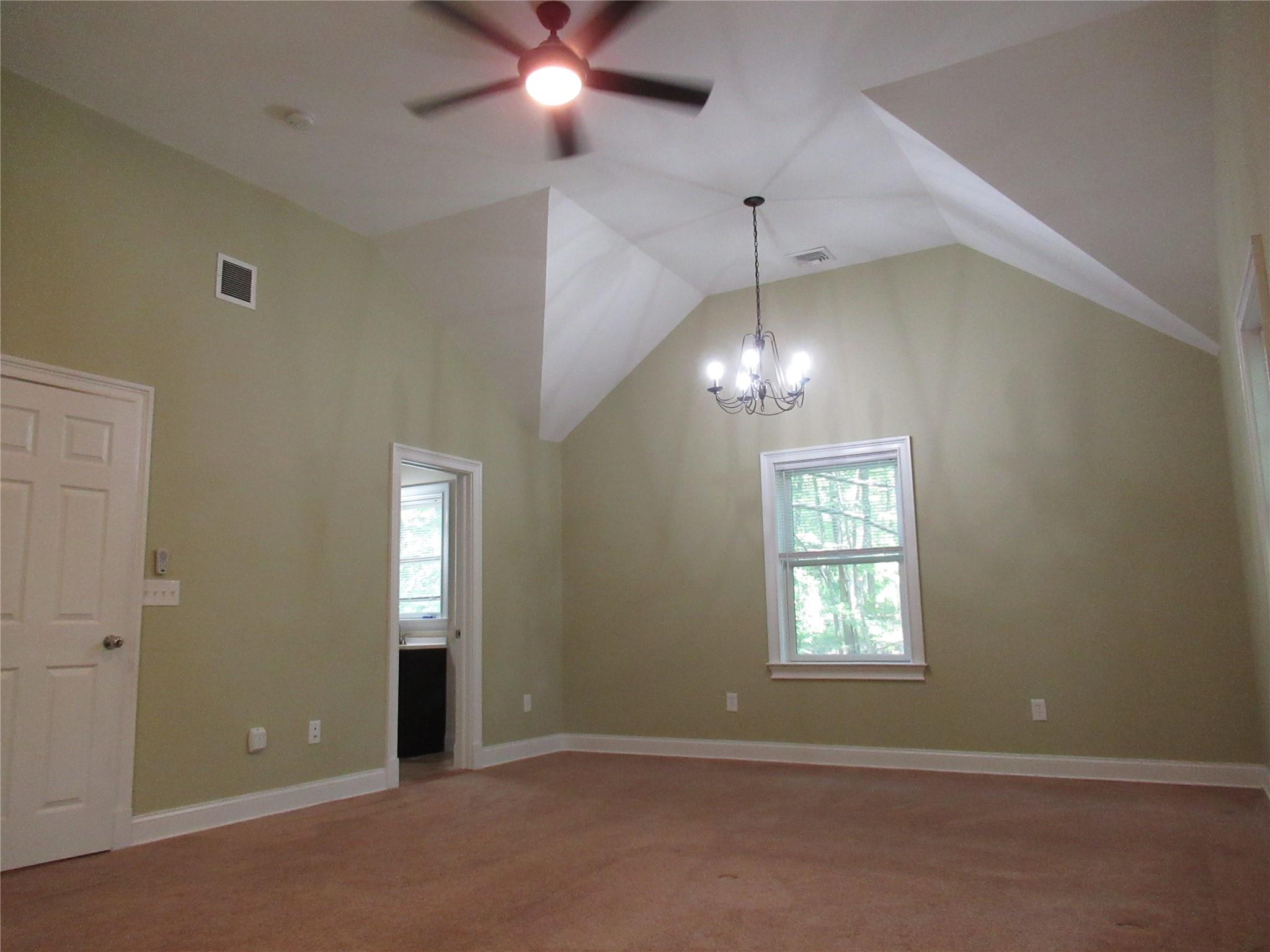 101 Bundy Hill Road Holmes, NY 12531 - Photo 17 of 28 an empty room with chandelier fan and windows