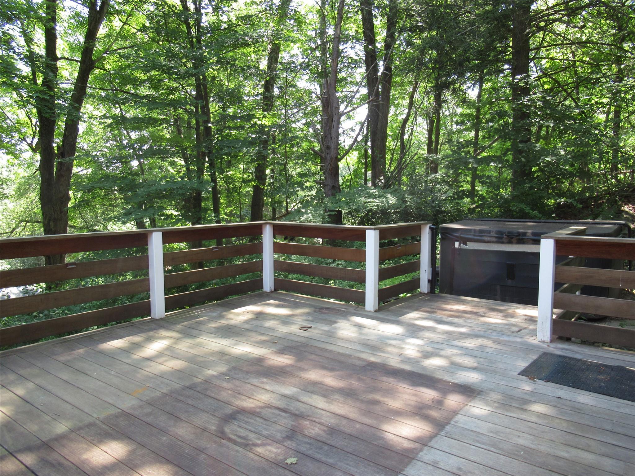 101 Bundy Hill Road Holmes, NY 12531 - Photo 22 of 28 a view of backyard with wooden fence and a bench