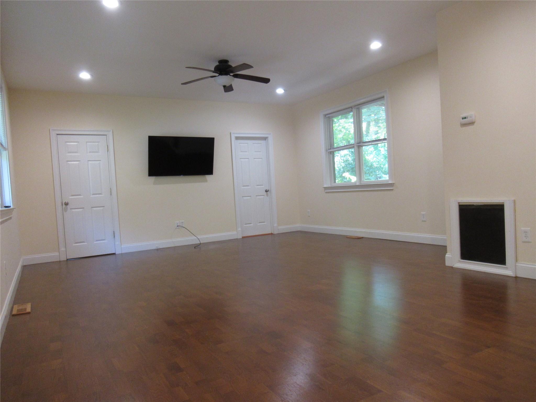 101 Bundy Hill Road Holmes, NY 12531 - Photo 6 of 28 an empty room with wooden floor and windows