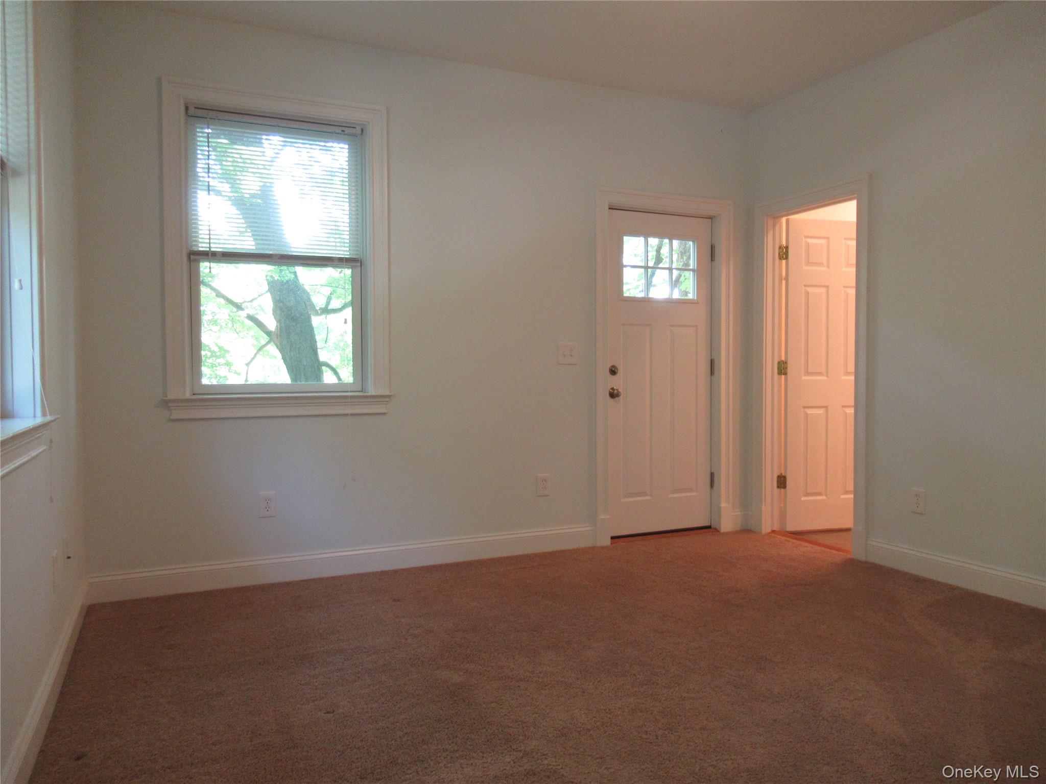 101 Bundy Hill Road Holmes, NY 12531 - Photo 9 of 28 an empty room with windows